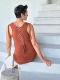 women's plant-based stretchy rayon jersey orange drape front tunic with adjustable side ruching and lace up back #color_copper
