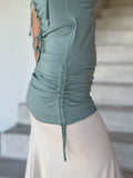 women's plant-based stretchy rayon jersey sage green drape front tunic with adjustable side ruching and lace up back #color_moss