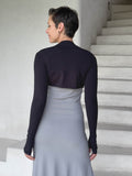 caraucci-woman-wearing-black-sleeve-shrug-layered-over-grey-dress-with-thumbhole-detail #color_black