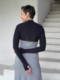 caraucci-woman-wearing-black-sleeve-shrug-layered-over-grey-dress-with-thumbhole-detail #color_black