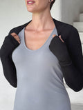 caraucci-woman-wearing-black-sleeve-shrug-layered-over-grey-dress-with-thumbhole-detail #color_black