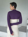 caraucci-woman-wearing-purple-sleeve-shrug-layered-over-cream-dress-with-thumbhole-detail #color_plum