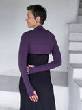 caraucci-woman-wearing-purple-sleeve-shrug-layered-over-cream-dress-with-thumbhole-detail #color_plum