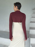caraucci-woman-wearing-maroon-sleeve-shrug-layered-over-cream-dress-with-thumbhole-detail #color_wine