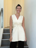 caraucci v neck sleeveless cream tunic with gathered bodice and flowing silhouette #color_cream