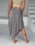 caraucci texture poncho worn as a skirt #color_stone