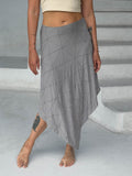 caraucci texture poncho worn as a skirt #color_stone