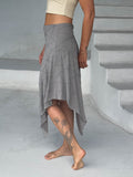 caraucci texture poncho worn as a skirt #color_stone