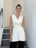caraucci v neck sleeveless cream tunic with gathered bodice and flowing silhouette #color_cream
